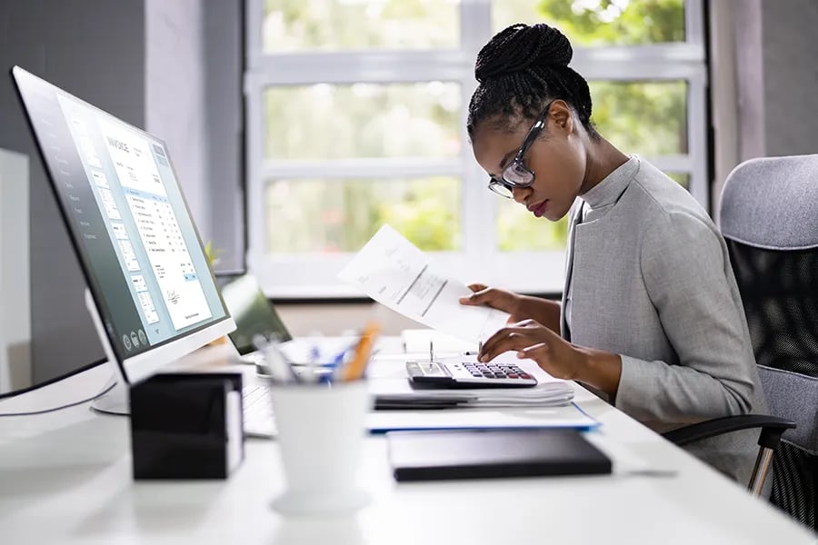 An ERP Consultant calculating costs for an ERP System