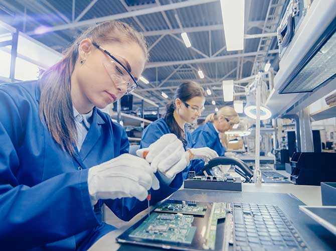 Women working in production conveyor belt